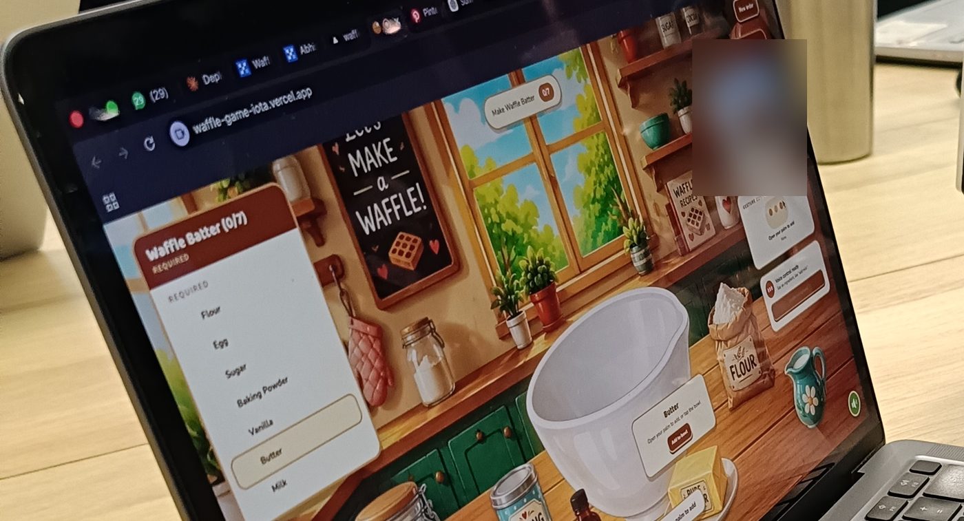 Waffle open on a MacBook at a desk, midway through picking butter for the batter.